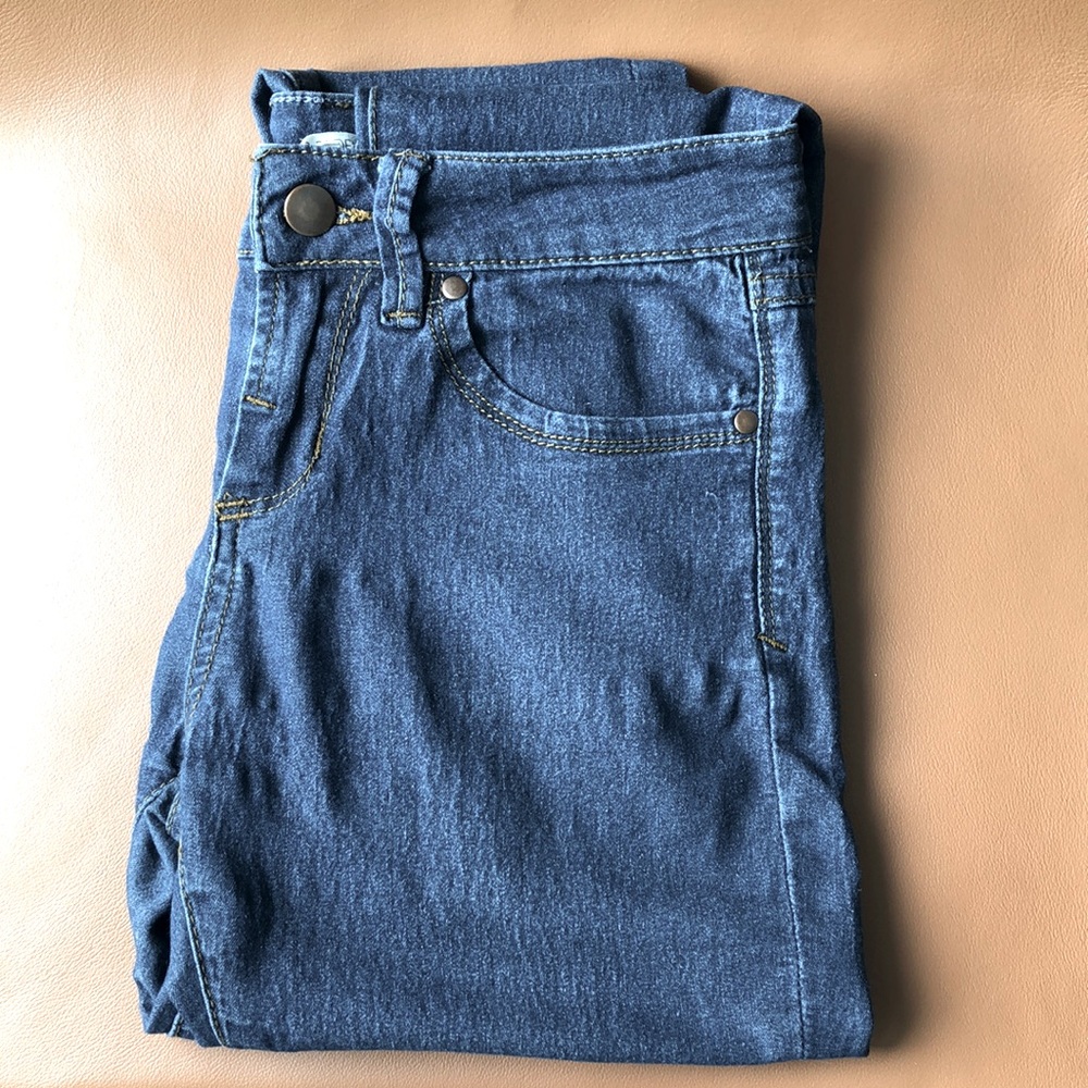 Forever 21 jeans. Medium to darker blue; brown gold stitching. Size 27
